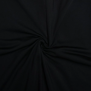 Gros plan du tissu côtelé noir de haute qualité montrant la texture et les coutures détaillées