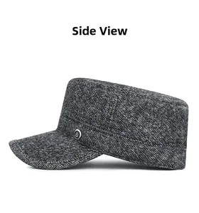 Side view of winter men's flat top cap with gray wool blend fabric and metal logo detail