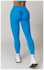 Close-up of the scrunch butt detail and high-waist design on bright blue yoga leggings