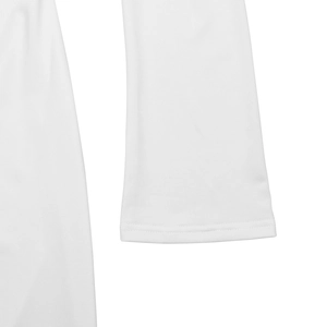 Detail view showing white knitted fabric texture and fine stitching on dress sleeve cuff