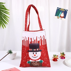 Christmas gift bag with Santa and snowman patterns on a festive white background