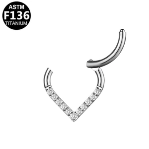 Detailed macro view of G23 titanium V-shape hinged segment ring with clear zircons