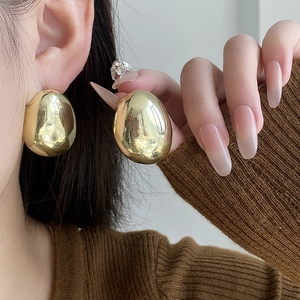 Modern gold oval lava earrings for women with a high-polished mirror finish