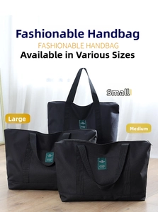 Three sizes of durable black canvas travel duffel bags with sturdy top handles and green labels