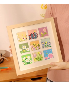 Detail view of 9-grid wooden frame showing textured oil pastel flower art and 3D relief