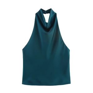 Detailed close-up of dark teal satin halter top showing smooth silky fabric texture