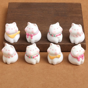 Set of eight adorable white resin cat figurines with colorful collars on a wooden base