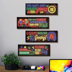 Set of four neon gaming wall art signs featuring controllers and game terminology
