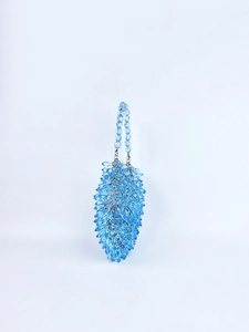 Detail of blue acrylic crystal beaded handbag showing the woven texture and handle