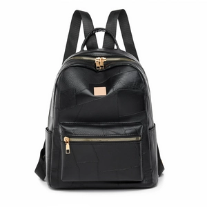 Minimalist black leather backpack with gold hardware in a sleek symmetrical front view