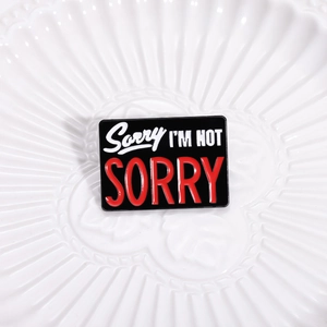 Enamel lapel pin with Sorry I'm Not Sorry text in a minimalist geometric square design