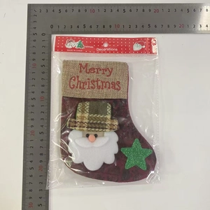 Detail view of retro faux leather Christmas stocking with Santa Claus and snowflake embroidery