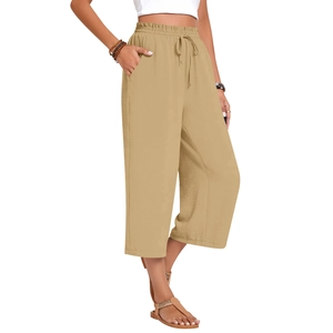 Detail view of khaki linen wide-leg pants showing elastic high waist with adjustable drawstring