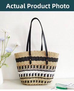 Detail of colorful striped straw tote bag featuring black leather handles and metal rivets