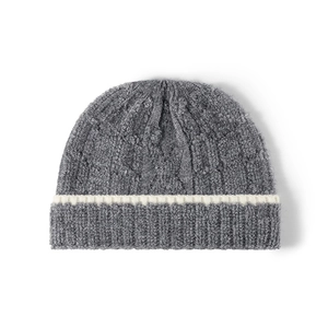 Thick dark grey cable knit beanie with white horizontal stripe and plush warm texture