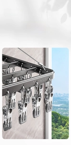 Detail of gray aluminum drying rack with stainless steel clips for balcony laundry use