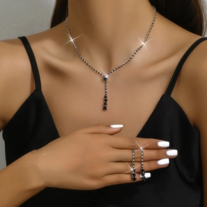 Elegant wedding jewelry set with black gemstone necklace and earrings on model