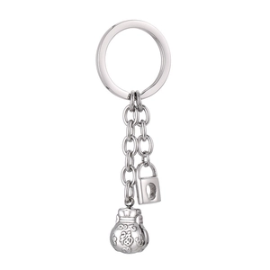 Silver stainless steel keychain with traditional lucky pouch and lock charms on white backdrop