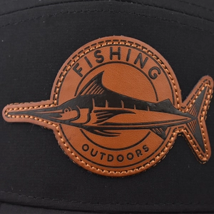 Classic black outdoor baseball cap with leather fishing patch and curved brim detail
