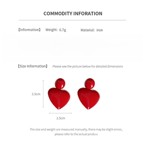 Detailed view of red heart earrings with iron material specs and size measurements