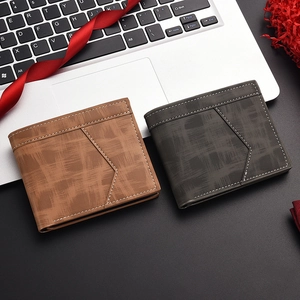 Detail of men's wallets showing textured synthetic leather and contrast stitching detail