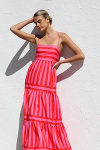 Close-up of pink and red striped maxi dress with tiered ruffles and spaghetti straps