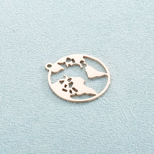 Macro detail of a rose gold hollow world map pendant with a polished metallic finish