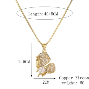 Detail view of gold butterfly pendant with cubic zirconia and exact product dimensions