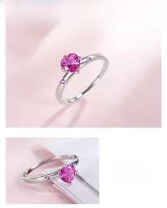 Detail view of heart-cut pink zircon silver ring with elegant claw setting