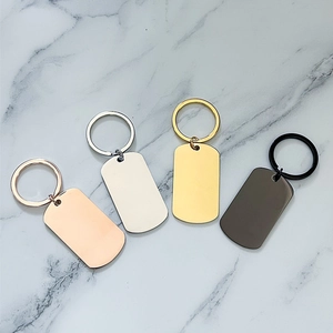 Polished stainless steel dog tags in rose gold, silver, gold, and black with keyrings