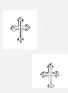 Close-up of S925 sterling silver cross earrings with triple bead detail and polished finish