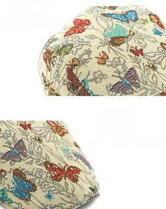 Detail van de kleurrijke vlinder jacquard stof en verstelbare verstevigde zonneklep rand