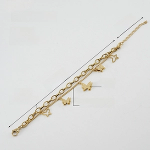 Detail of 18K gold-plated butterfly bracelet with double-layer steel chains and sandblasted finish