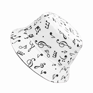 White bucket hat with black music note pattern in a classic flat top fisherman style