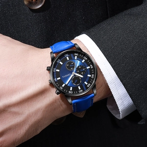 Close-up of Geneva men's business watch with blue leather strap and black alloy case
