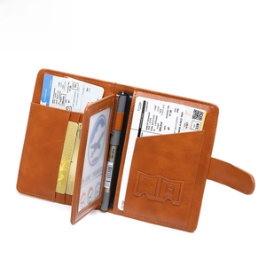 Brown leather RFID blocking passport holder with SIM card slots and travel wallet function