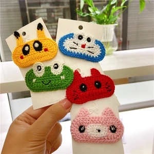 Five handmade knitted animal hair clips for girls including a yellow cartoon character