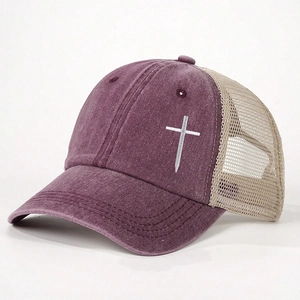 Close-up of cross embroidery and mesh back on a vintage burgundy trucker hat