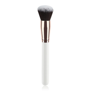 Detail of soft bicolored synthetic bristles with rose gold tube and white handle