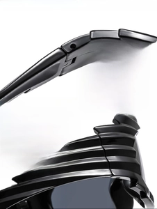 Detail view of durable metal hinges and textured black frames on hip hop sunglasses