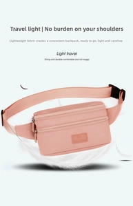 Lightweight pink oxford waist bag detail with layered pockets and floating feather imagery