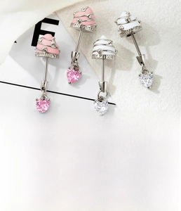 Detail of sweet ice cream pendant earring with heart zircon in polished titanium steel