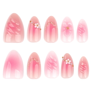 3D floral almond press-on nails with pink ombre gradient and golden bead accents