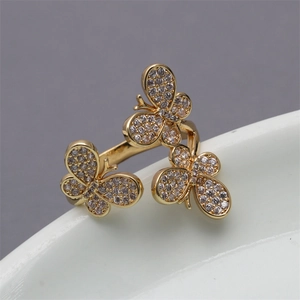 Adjustable gold butterfly ring featuring three micro-set zircon butterflies on a band