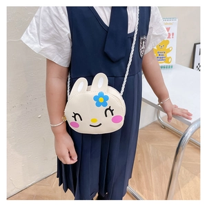 Detail of cute white rabbit cartoon crossbody bag for girls with braided strap and gold hardware