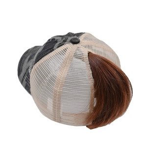 Detail of grey camo ponytail baseball cap featuring breathable mesh and brown hair extension