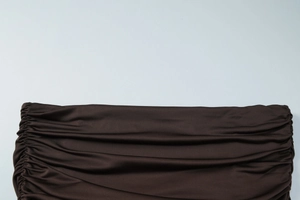 Detail of silk-like brown pleated fabric with double-sided shirring craftsmanship
