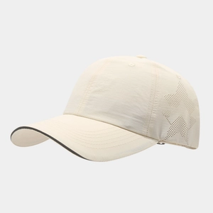Detailed view of quick-dry baseball cap featuring breathable star-shaped laser perforations