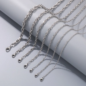 Close-up of assorted silver stainless steel link chains with secure lobster clasps
