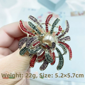 Detail shot of vintage firework brooch with colorful crystals and center pearl